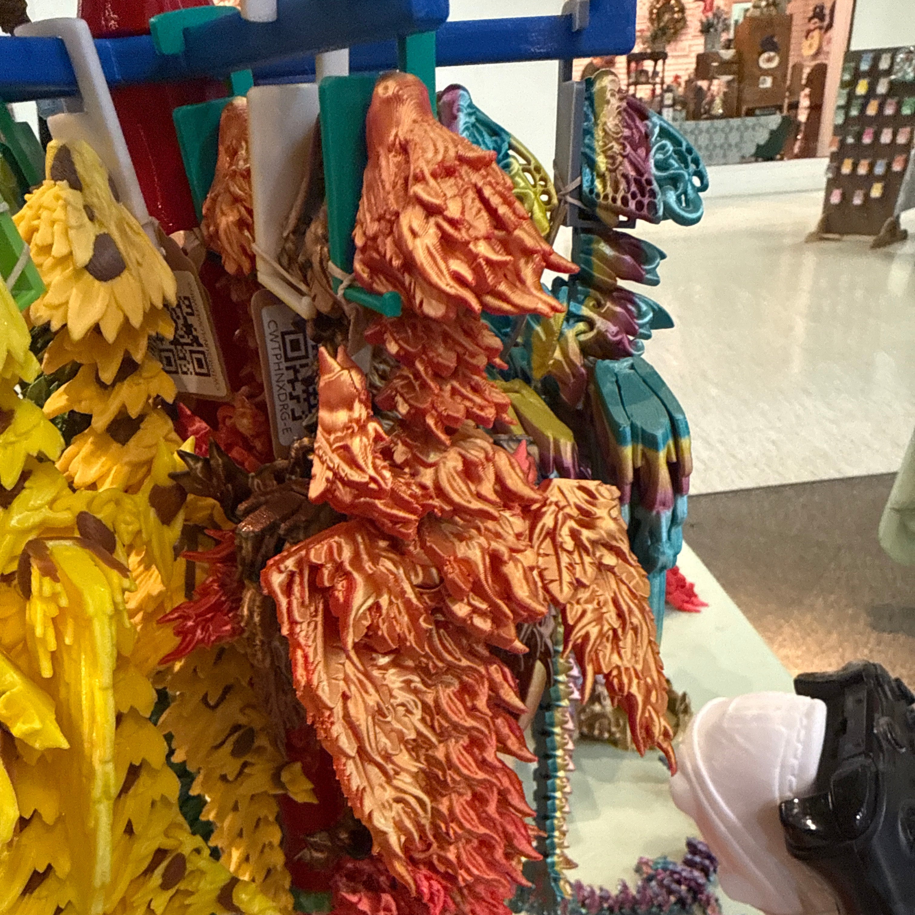 Toy dragon model with colorful details on a display stand